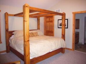 Master bedroom w timberframed bed