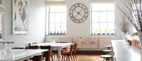 Huge state of the art kitchen with an abundance of light and a piano