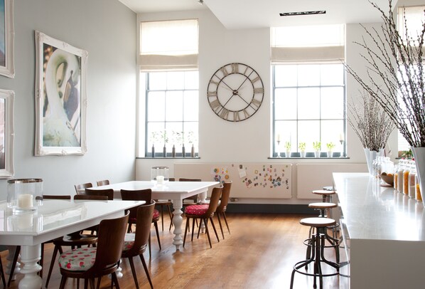 Huge state of the art kitchen with an abundance of light and a piano