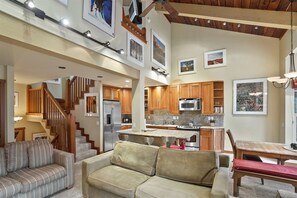 Living Room to Entry and Loft Stairs