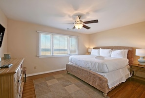 Sleep soundly in the primary suite with comfortable king bed, TV, and private bathroom.