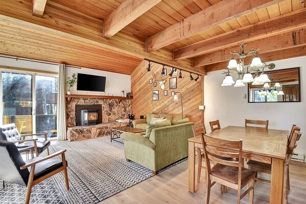 Living Room with a pellet stove and access to the deck