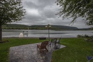 View from yard, with fire pit and patio