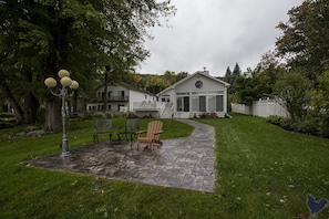 Level yard with stamped concrete patio