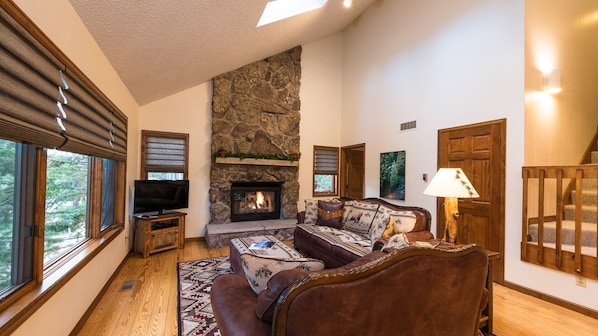 Living Room with Large Windows and Gas Fireplace