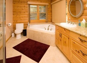 Master bath with whirlpool tub and shower for 4.