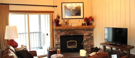 Mammoth Condo Rental Chamonix 60 - Cozy Living Room has a Flat Screen TV and Wood-stove