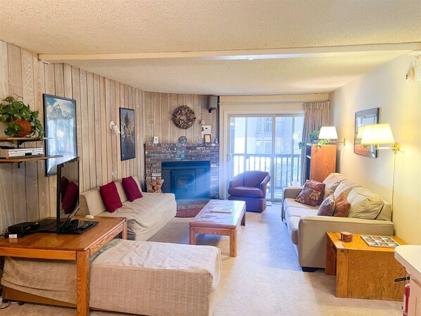 Mammoth Condo Rental Chamonix 45 - LR with Fireplace and Outside Deck Access