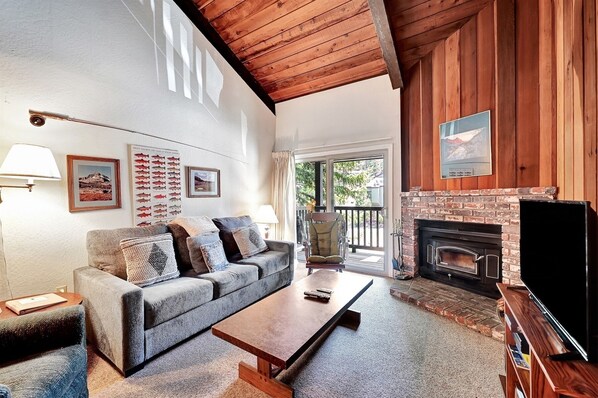 Living room with a wood burning fireplace