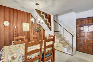 Dining table and stairs to the loft