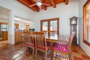 Easily access the kitchen or the patio from the dining room.