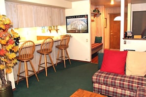 Mammoth Lakes Vacation Rental Sunshine Village 113 - Living Room Towards Kitchen and Entrance