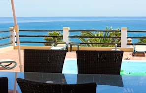 Outdoor dining on one of the covered terraces. A view from all seats.