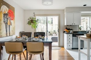 Dining table with dishes and chairs to easily sit 5 at one time. 