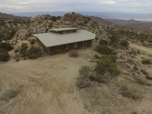 Drone shot of the 2 acre property and backyard rock formations 