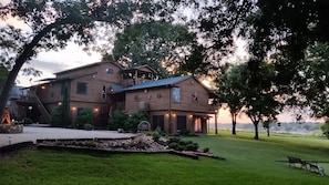 entrance with lake in front and putting green on far right