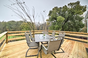 The vacation rental home boasts lush views and a brand new deck!