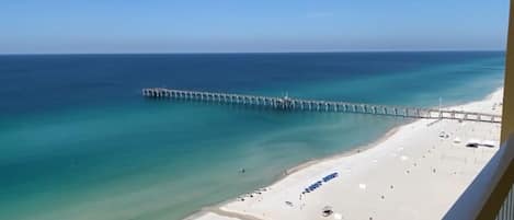 View of the beach and pier from the balcony.