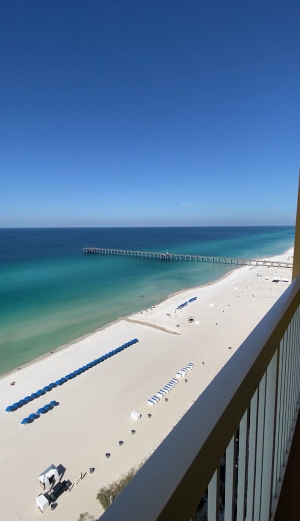 View of the beach and pier from the private balcony.