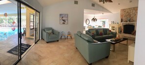 Living room with view of patio/pool.