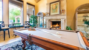 Indoor pool table w/ fireplace, high top table, backyard & Mummy Mountain views