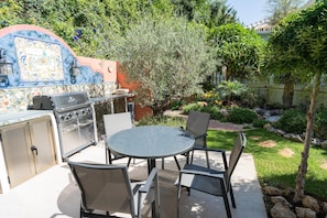 BBQ dining, fridge & hand sink. View here to 'Rockery' in the 'Secret Garden'.