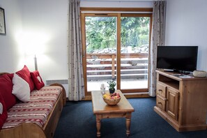 Sink into the cozy sofa after a day spent exploring the area.