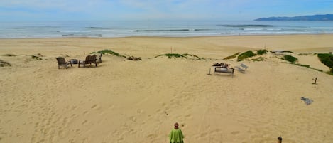 Seagull  firepit and chairs on left.    Sanddollar on right. Sanddollar view.