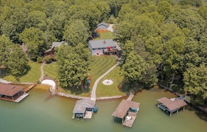 Aeriel view of large home and yard.