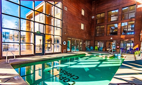 Indoor solarium pool/Jacuzzi adjacent to fitness center & men/women saunas.