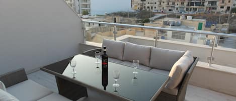 Enjoy a glass of wine and some Maltese snacks as you watch the sun go down