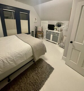 Another view of second bedroom upstairs with queen bed.