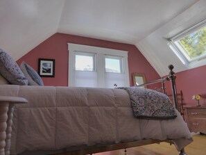 Main bedroom with great skylight window. 