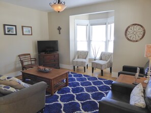Living room with pull out queen sofa. 
