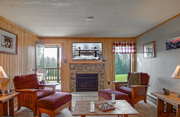 Living room with gas fireplace and queen sleeper sofa