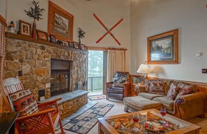 The living room has a wood fireplace.