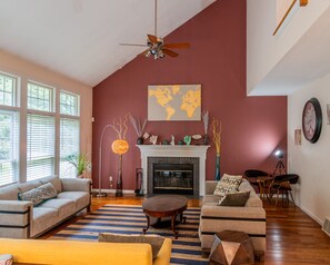 Cozy Corner: Fireplace Elegance & Artistic Touches!