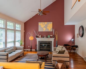 Cozy Corner: Fireplace Elegance & Artistic Touches!