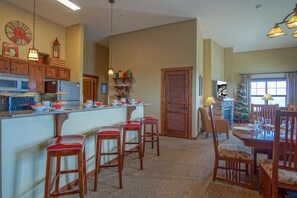 The kitchen bar has seating for 4.