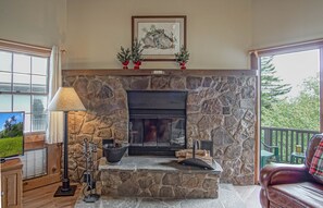 The living room has a wood fireplace.