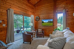 Living room with view of deck