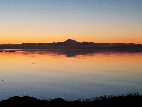 Sunrise on Griffin bay silhouetting Mt. Baker. 