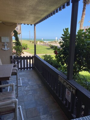 Sit on your balcony and enjoy the view of the beach.  15 SECOND walk to the sand