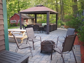 Large patio with fire pit and plenty of seating