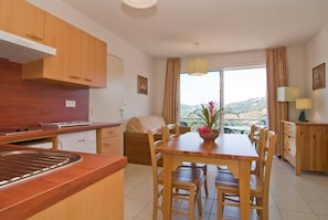 Prepare a meal in the kitchenette and enjoy your food at the dining table.