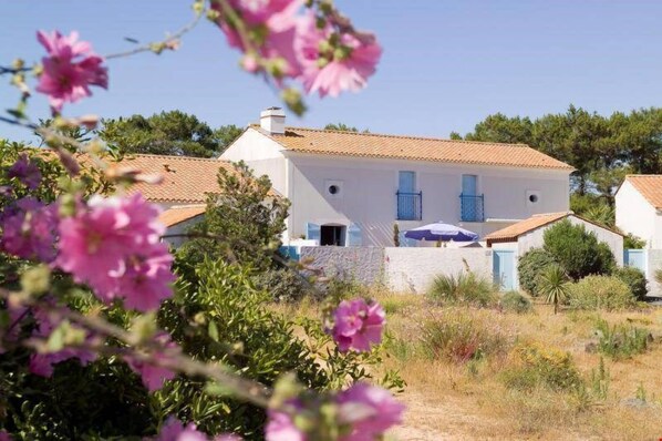 Relax in your own private garden after a wonderful day by the lake.