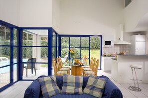 Find peace and relaxation with your close friends and family in this stunning living room featuring bright decor.
