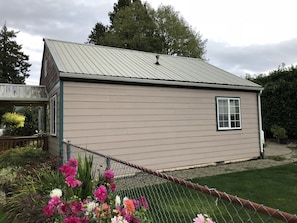 Side of house and fenced yard