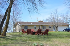 Large front yard with fire pit!  Spring pic.  Great Family destination