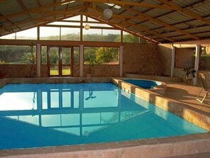 Indoor pool house, with jacuzzi, massage table, weights, pool table, ping pong.